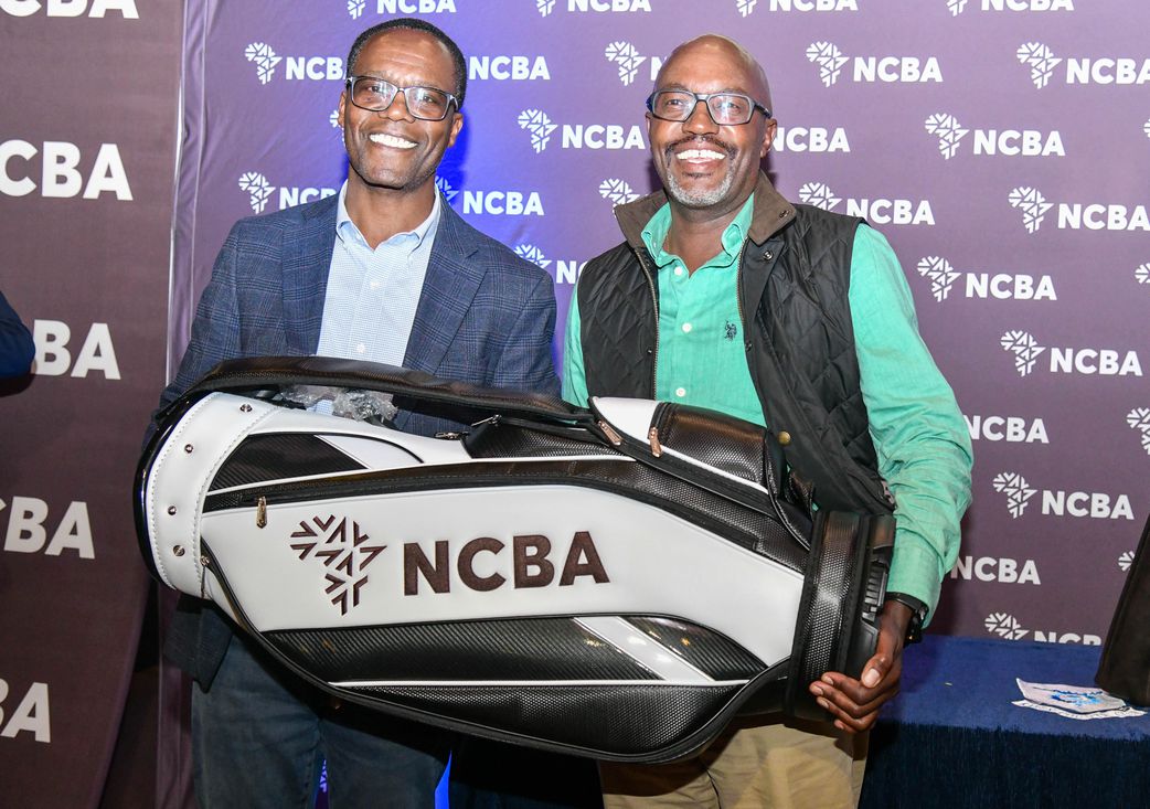 Overall Winner at the 2025 NCBA Golf Series qualifying leg at Karen CC Gilbert Maina is awarded by NCBA Group Managing Director John Gachora
