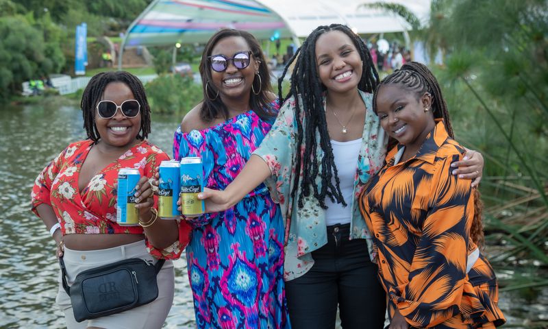(Left-Right) Liberata Thiga, Irene Kangara and Mercy Mwini do a waterfront cheers.