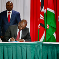 President William Ruto and Raila Odinga signing a political pact at KICC on March 7, 2025 with DP Kithure Kindiki and Senator Ledama Ole Kina standing in the background