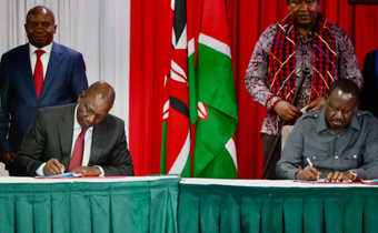 President William Ruto and Raila Odinga signing a political pact at KICC on March 7, 2025 with DP Kithure Kindiki and Senator Ledama Ole Kina standing in the background