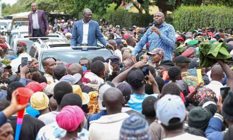 File image of President William Ruto and DP Kithure Kindiki watch as Kikuyu MP Kimani Ichung'wah addresses a crowd