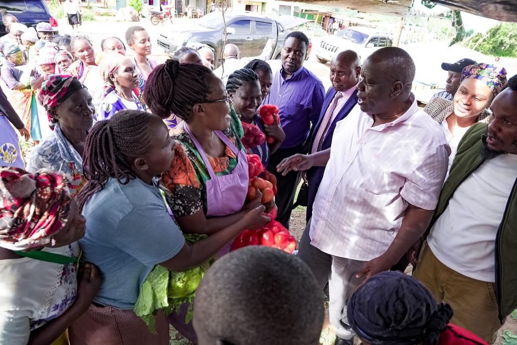 Former Interior CS Fred Matiang'i interacting with traders and purchasing local commodities in Kitui on December 20, 2024.