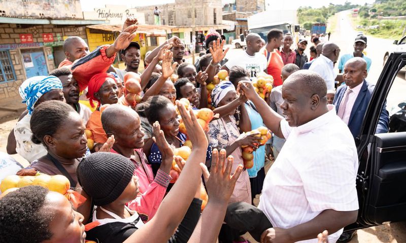 Former Interior CS Fred Matiang'i interacting with traders and purchasing local commodities in Kitui on December 20, 2024.