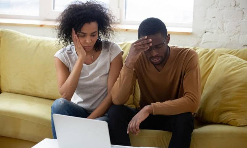 A young couple seemingly worried
