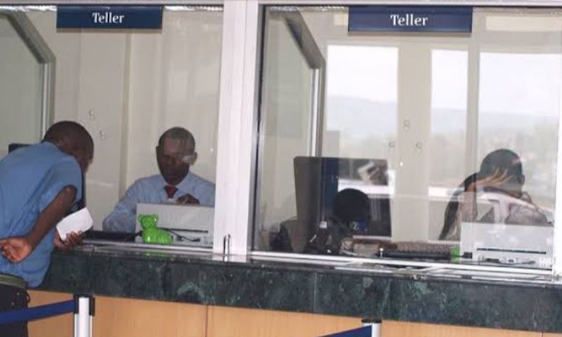 Tellers in a Kenyan bank