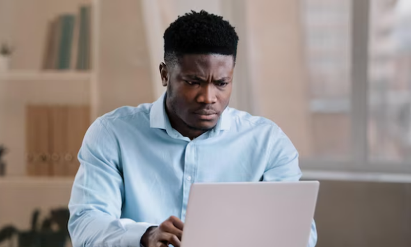 A man using a laptop at home