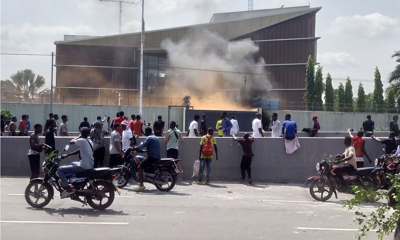 Protesters set fire to the gate of the Belgian embassy in Kinshasa on Tuesday