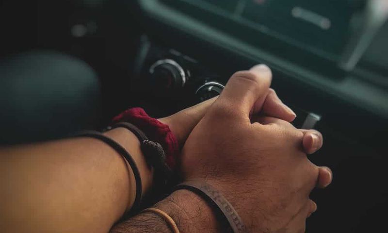A couple holding hands