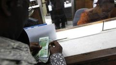 Taxe sur les transferts d'argent par téléphone mobile et des établissements de monnaie électronique