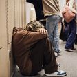 Picture of a girl crouched down in a school corridor.Maskot/Getty Images