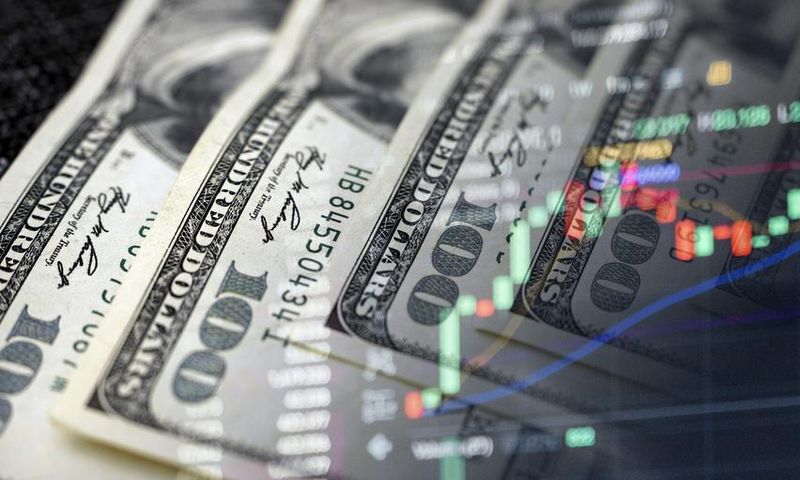 Cash dollars and stock market indicators (inflation, economy, crisis, finance)Getty Images