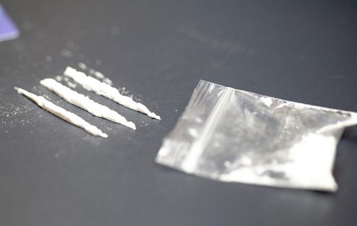 A stock photo shows a bag of cocaine with lines of the drug.Getty Images