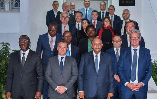 Le Groupe Auchan à travers son président venu annoncer l'ouverture des magasins Auchan en Côte d'Ivoire au Premier Ministre ivoirien Patrick Achi