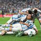 Messi's teammates piled on him when he scored Argentina's opener.Getty/Dan Mullan