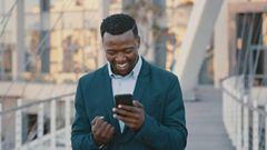 Blackman excited looking at the phone