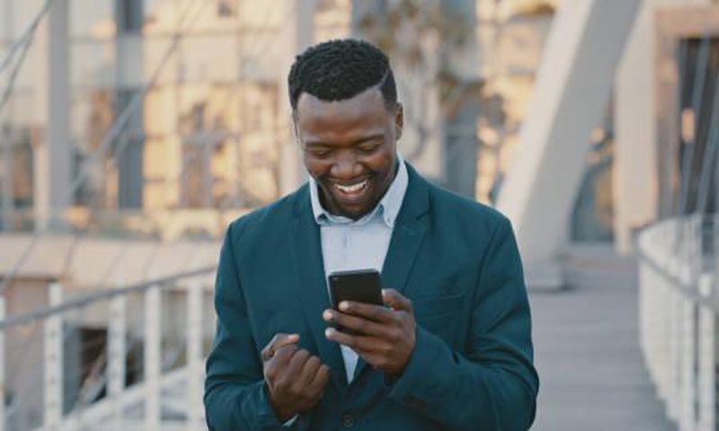 Blackman excited looking at the phone