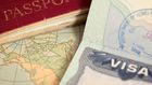 A vintage US map, passport and visa.belterz/Getty Images
