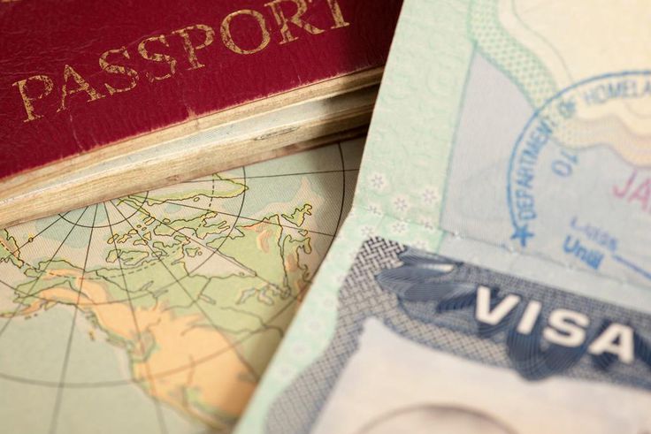 A vintage US map, passport and visa.belterz/Getty Images