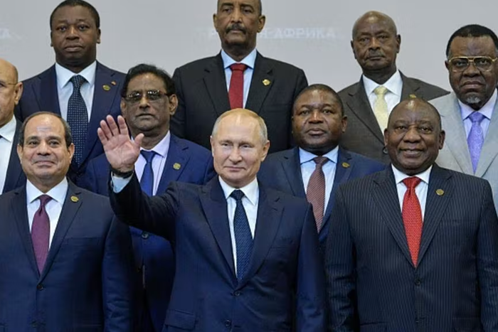 Photo de Poutine entouré de dirigeants du monde