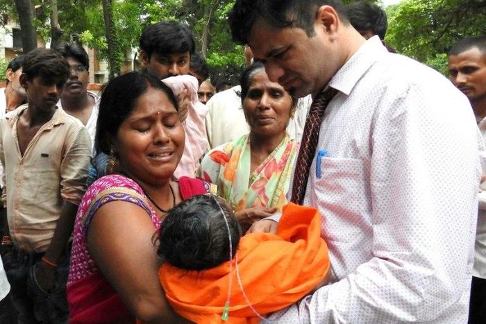 This file photo taken on August 12, 2017 shows relatives mourning the death of a child at the Baba Raghav Das Hospital in Gorakhpur, in the northern Indian state of Uttar Pradesh