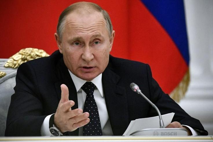 Russian President Vladimir Putin delivers a speech during a meeting at the Kremlin in Moscow on December 26, 2018