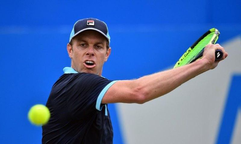 Sam Querrey of the US returns during his men's singles second round match against Australia's Jordan Thompson at the ATP Aegon Championships tennis tournament at the Queen's Club in west London on June 22, 2017