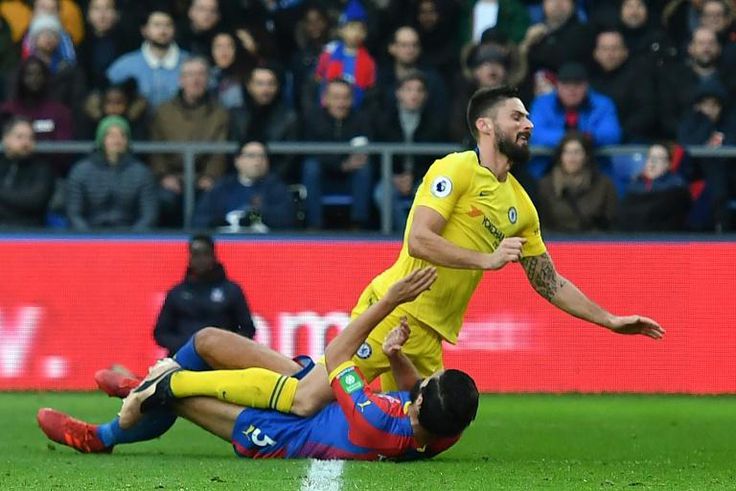 Olivier Giroud (top), pictured colliding with Crystal Palace's James Tomkins, joined a growing Chelsea injury-list during a 1-0 win at Selhurst Park in a Premier League match on Sunday