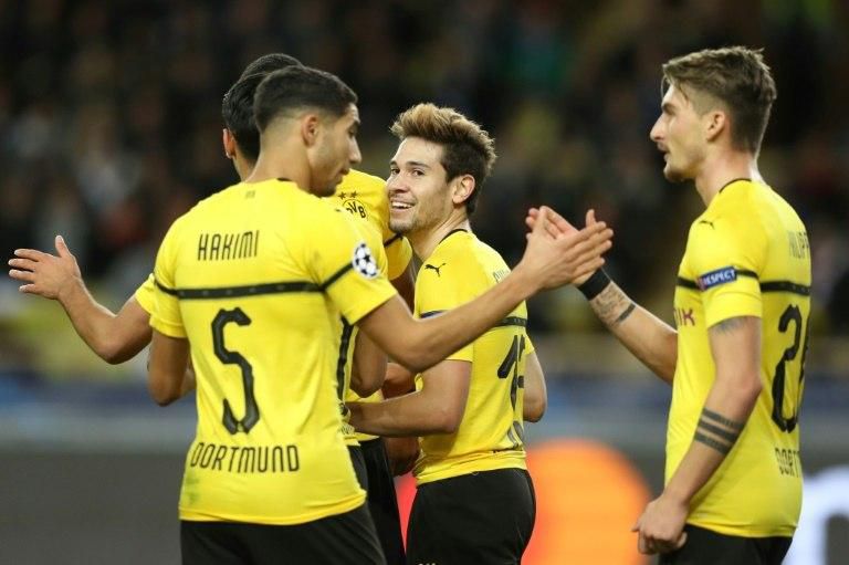 Guerreiro's double saw Dortmund finish top of Group A above Atletico Madrid