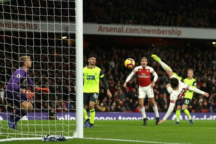 Arsenal's Lucas Torreira celebrates after scoring the only goal of a 1-0 win over Huddersfield in acrobatic fashion