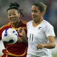 China's Zhang Ouying (left) has died aged 43 from cancer. She is seen here competing with New Zealand's Marlies Oostdam during the 2007 World Cup