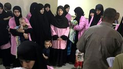 Thirty children belonging to Russian women who have been sentenced to life in prison on grounds of joining the Islamic State (IS) group (pictured in Baghdad's Central Criminal Court in April 2018) have arrived in Moscow