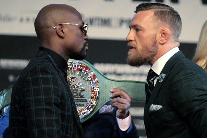 Boxer Floyd Mayweather Jr. (L) and MMA figher Connor Mcgregor face-off during a media press conference August 23, 2017 at the MGM Grand in Las Vegas, Nevada