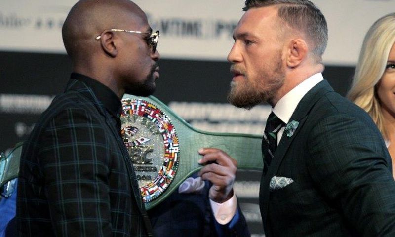 Boxer Floyd Mayweather Jr. (L) and MMA figher Connor Mcgregor face-off during a media press conference August 23, 2017 at the MGM Grand in Las Vegas, Nevada