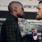 Boxer Floyd Mayweather Jr. (L) and MMA figher Connor Mcgregor face-off during a media press conference August 23, 2017 at the MGM Grand in Las Vegas, Nevada