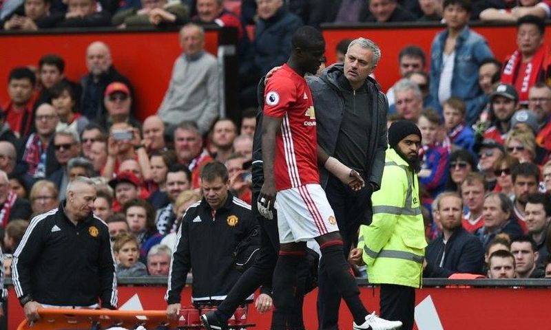 Manchester United's defender Eric Bailly (L) talks with manager Jose Mourinho during an April 2017 match