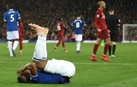 Liverpool celebrate their late win against Everton at Anfield