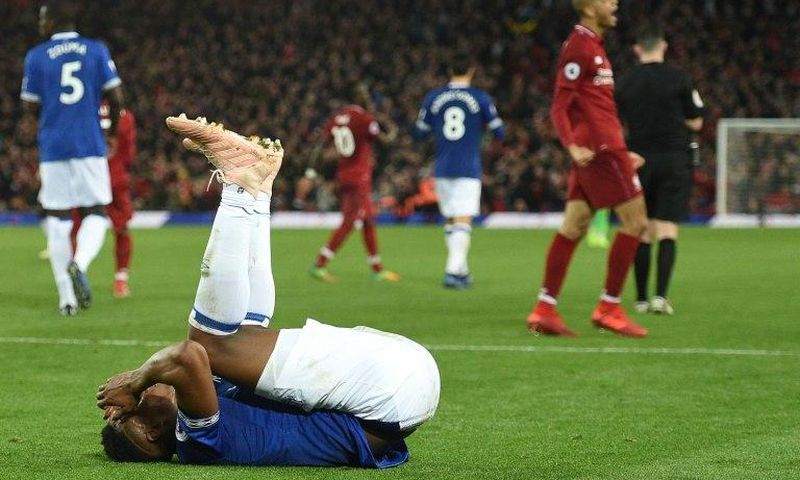 Liverpool celebrate their late win against Everton at Anfield