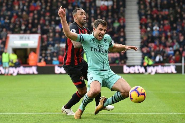 Bournemouth's Callum Wilson tangles with Arsenal's Sokratis Papastathopoulos