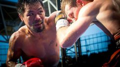 Manny Pacquiao (L) of the Philippines has declared he will return for a rematch