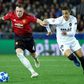 Phil Jones scored an embarassing own goal but Manchester United qualify for Champions League last 16