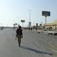 A Yemeni pro-government fighter walks in the rebel-held port city of Hodeida on December 15, 2018