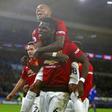 Ashley Young (top) climbs on Paul Pogba in celebration during Manchester United's 5-1 win at Cardiff