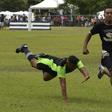 An inmate with the El Tocoron rugby team (R) eludes a prisoner from the rival Centinelas team during the Penitentiary Rugby Tournament in La Victoria, Aragua State, Venezuela