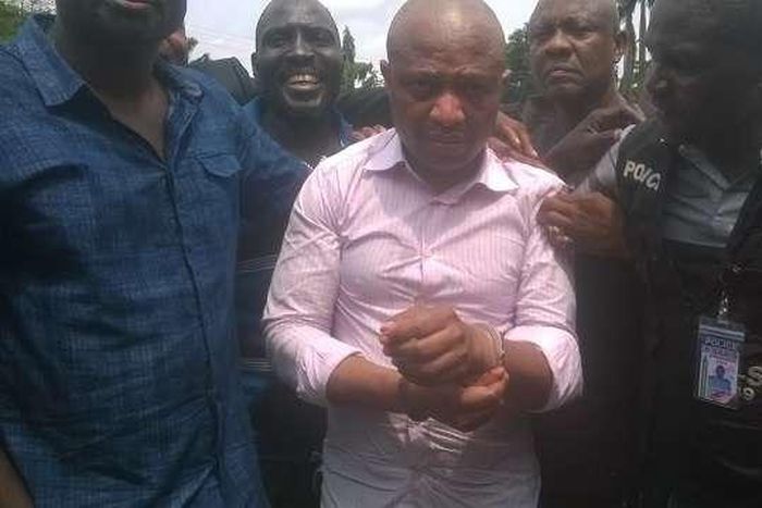 Evans flanked by security operatives
