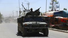 Afghan forces patrol in Ghazni in August 2018 following days of intense fighting against Taliban militants. US peace envoy Zalmay Khalilzad has raised doubts about the Taliban's desire to end the 17-year war