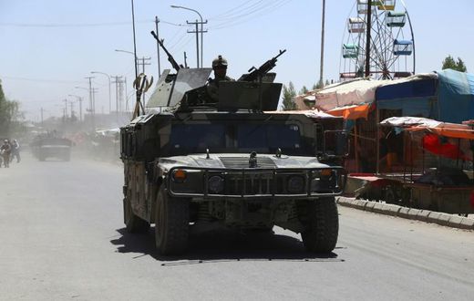 Afghan forces patrol in Ghazni in August 2018 following days of intense fighting against Taliban militants. US peace envoy Zalmay Khalilzad has raised doubts about the Taliban's desire to end the 17-year war