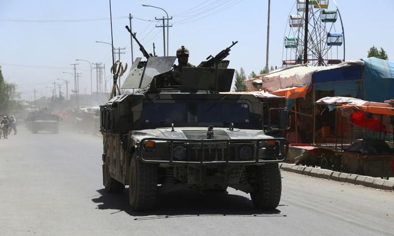 Afghan forces patrol in Ghazni in August 2018 following days of intense fighting against Taliban militants. US peace envoy Zalmay Khalilzad has raised doubts about the Taliban's desire to end the 17-year war