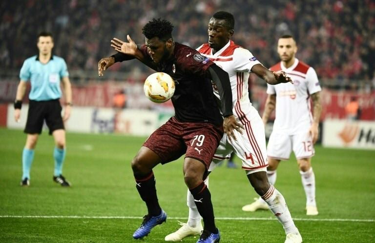 Olympiakos' Mohamed Camara (R) vies for the ball with Milan's Franck Kessie as the Italians crashed out of the UEFA Europa league.