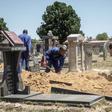 Gravediggers in Johannesburg, where between 45 and 60 graves are re-opened each week on average to allow for second burials