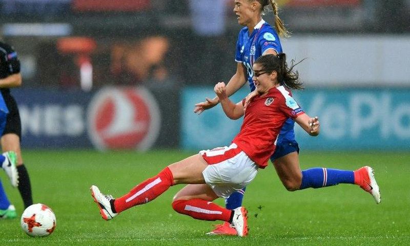 Austria's Sarah Zadrazil challenges Iceland's Dagny Brynjarsdottir (back) during their UEFA Women's Euro 2017 match, at the Sparta Stadium in Rotterdam, on July 26